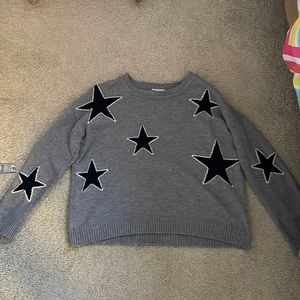 This product is a sweatshirt with navy blue stars